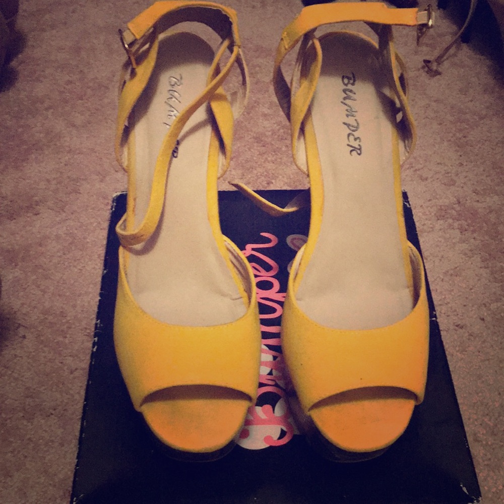 Woman’s yellow pumps